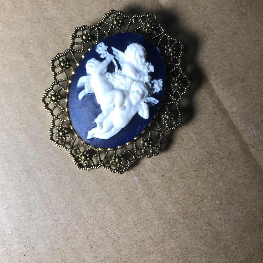 Cupid broach